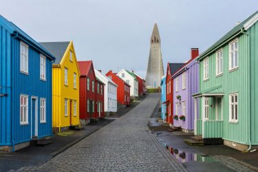 Colorful low-rise timber houses on Skolavordustigur leading up to Hallgrimskirkja in Reykjavik